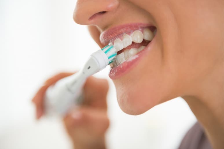 Woman Brushes Her Teeth with Her Own Homemade Organic Toothpaste