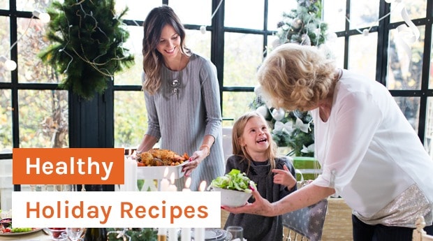 mother, child, and grandmother setting out food