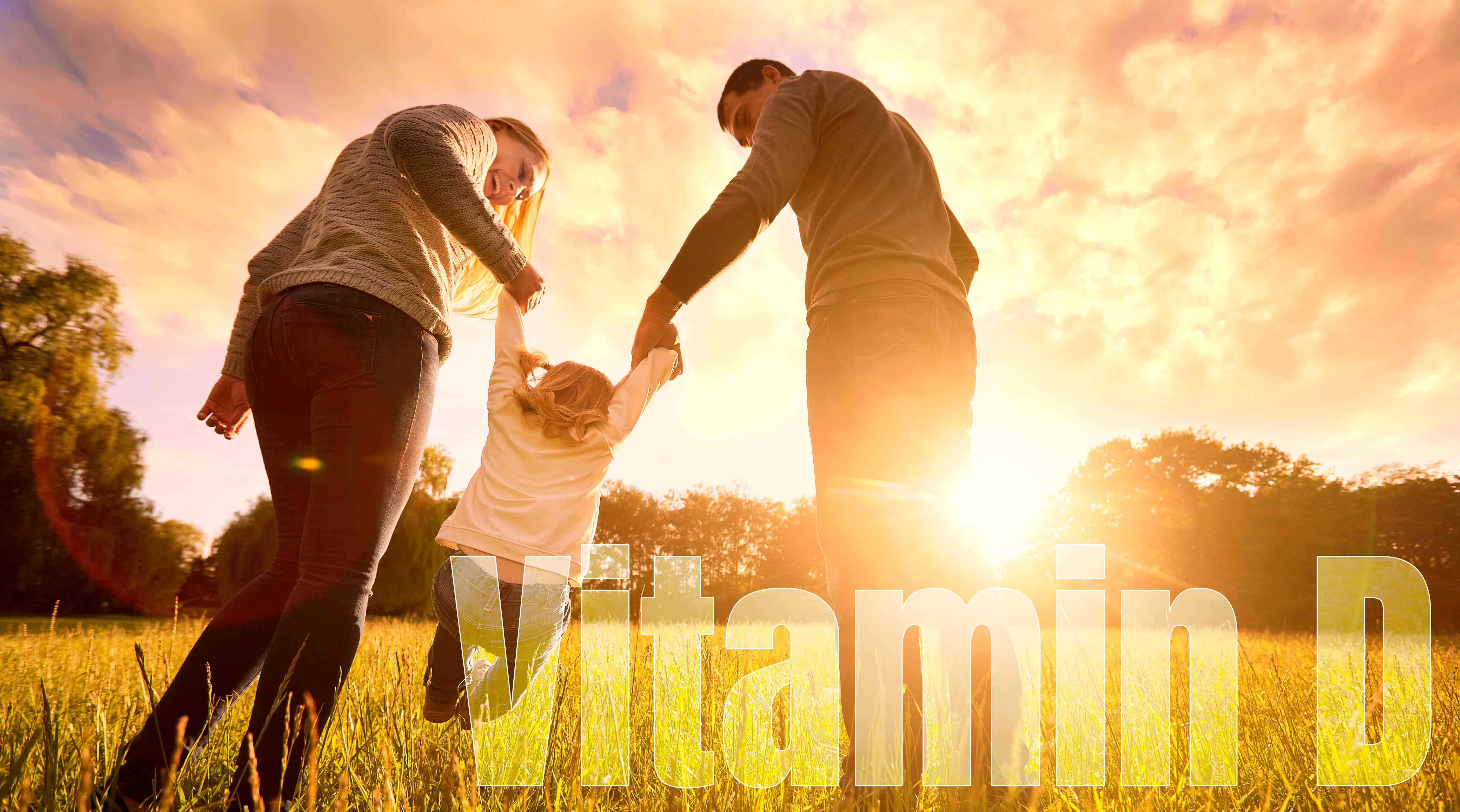 Family Holding Hands Over a Vitamin D Banner