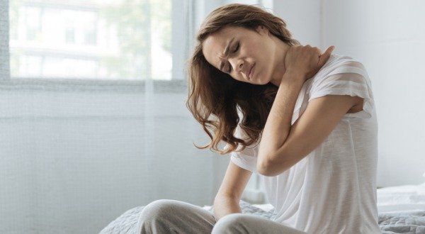 Woman Suffering Neck Pain From Inflammation
