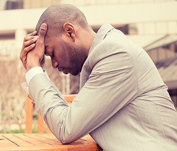 man feeling tired & stressed out